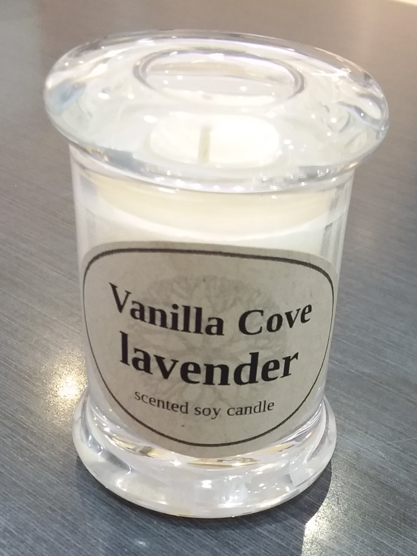 Vanilla Cove Soy Candle 20 hour lavender fragrance clear glass jar and glass lid