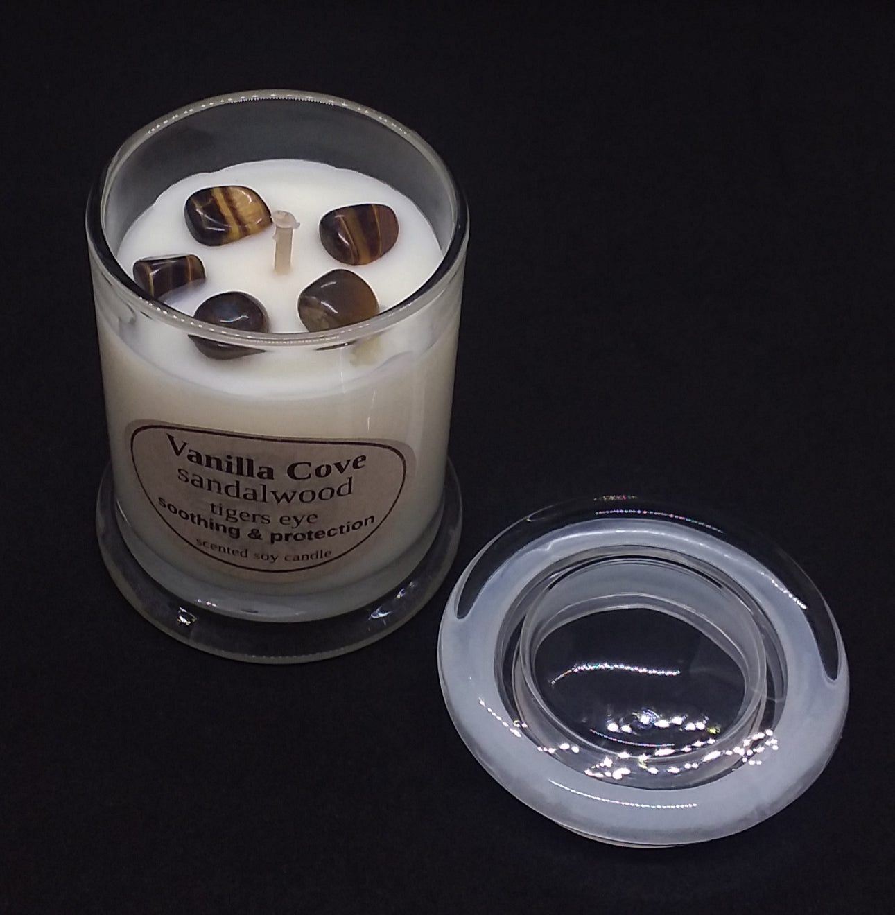 Vanilla Cove Soy Candle 45 hour Sandalwood fragrance with Tigers Eye crystals in clear glass jar and glass lid