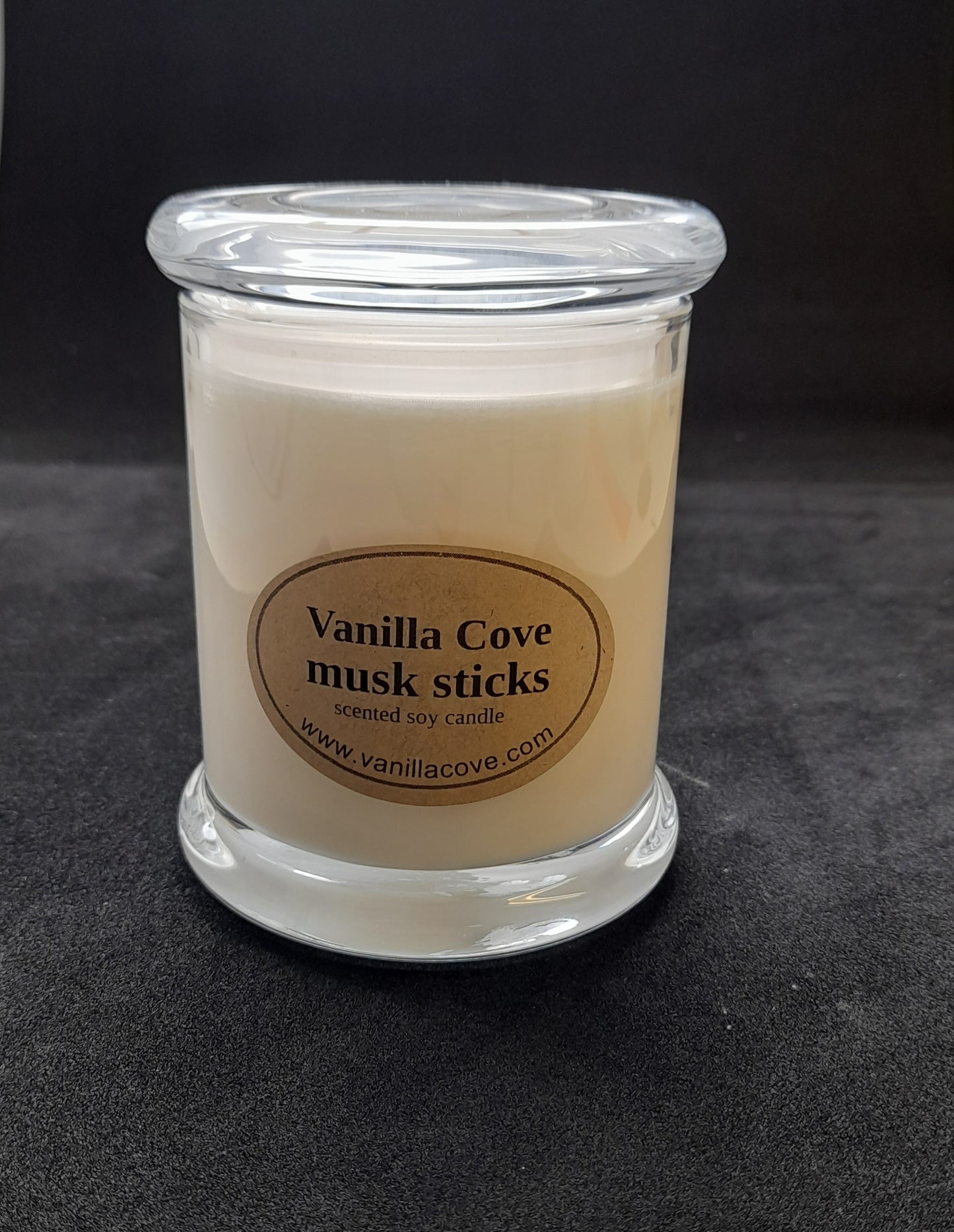 Vanilla Cove Soy Candle 50 hour Musk Sticks Fragrance in clear glass jar and glass lid