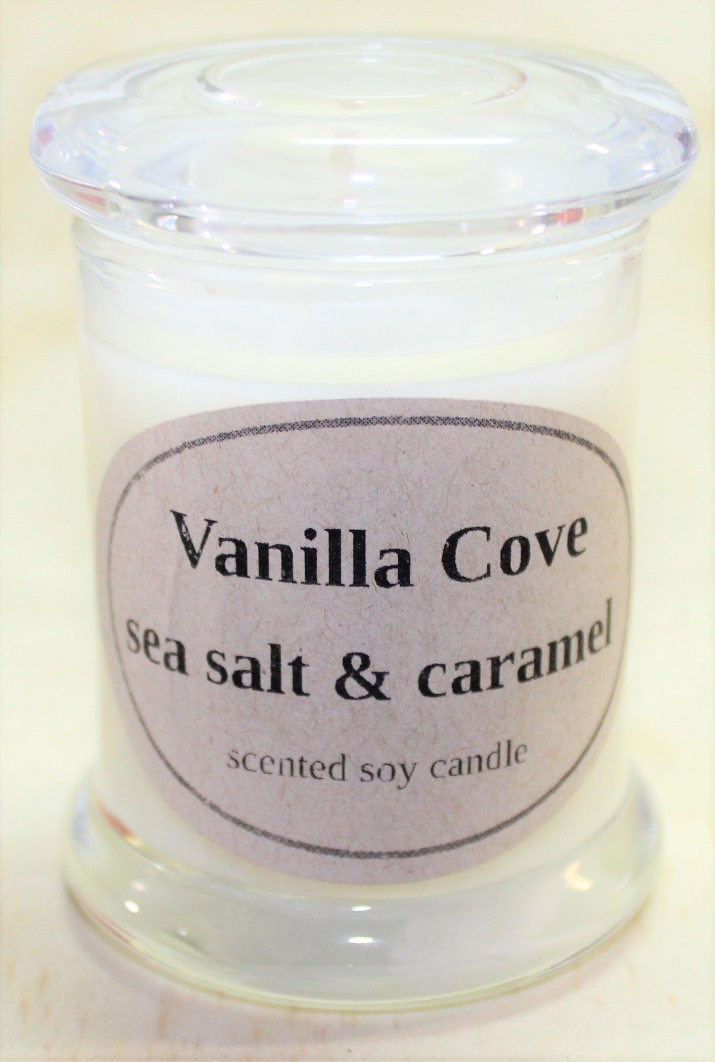 Vanilla Cove Soy Candle 20 hour Sea Salt and Caramel fragrance clear glass jar and glass lid