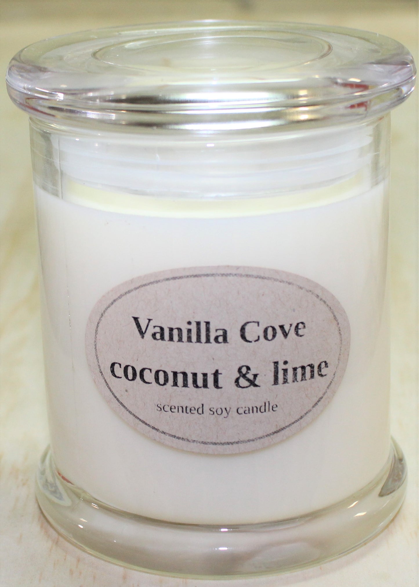Vanilla Cove Soy Candle 50 hour Coconut and Lime Fragrance in clear glass jar and glass lid
