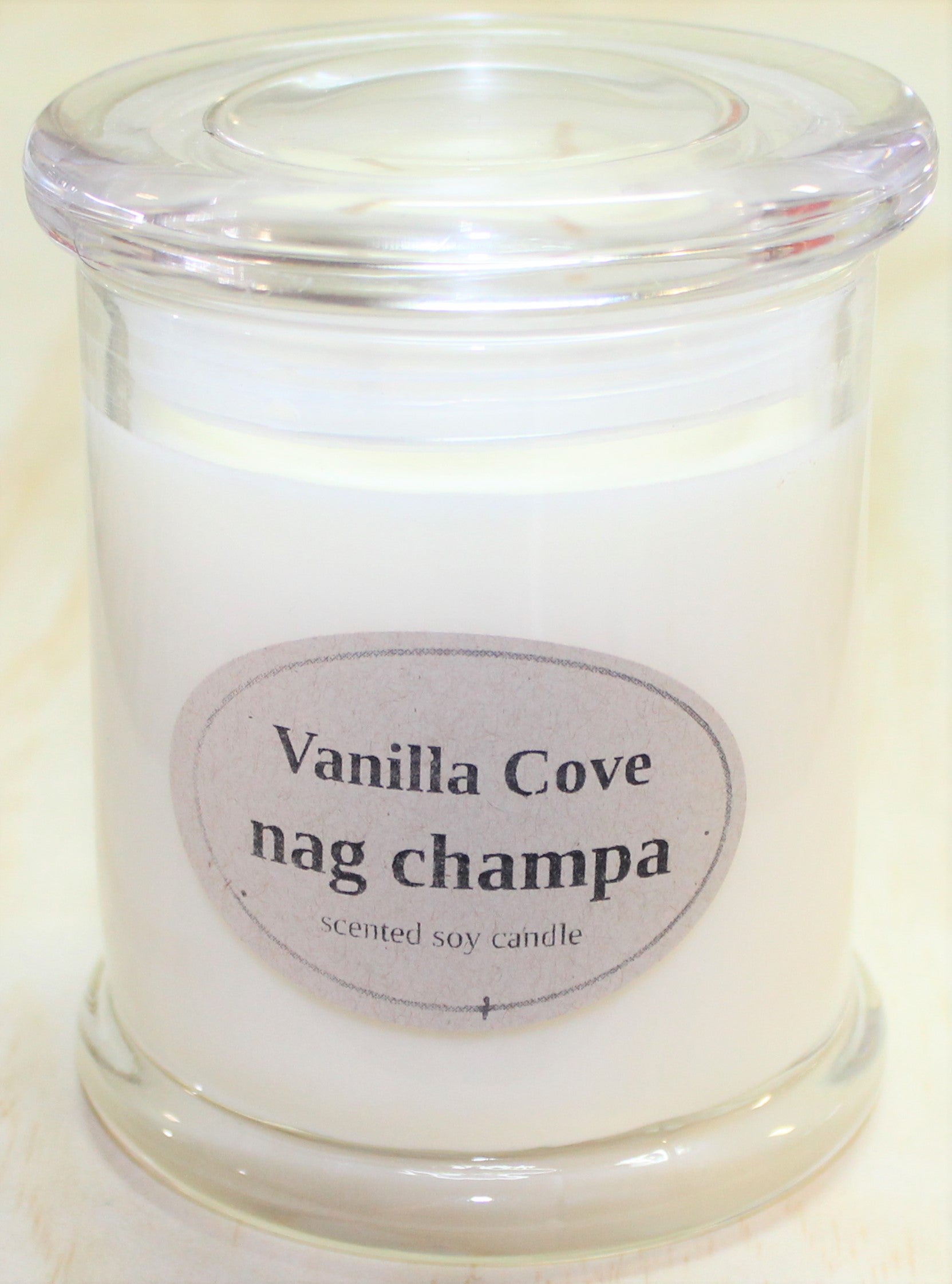Vanilla Cove Soy Candle 50 hour Nag Champa Fragrance in clear glass jar and glass lid