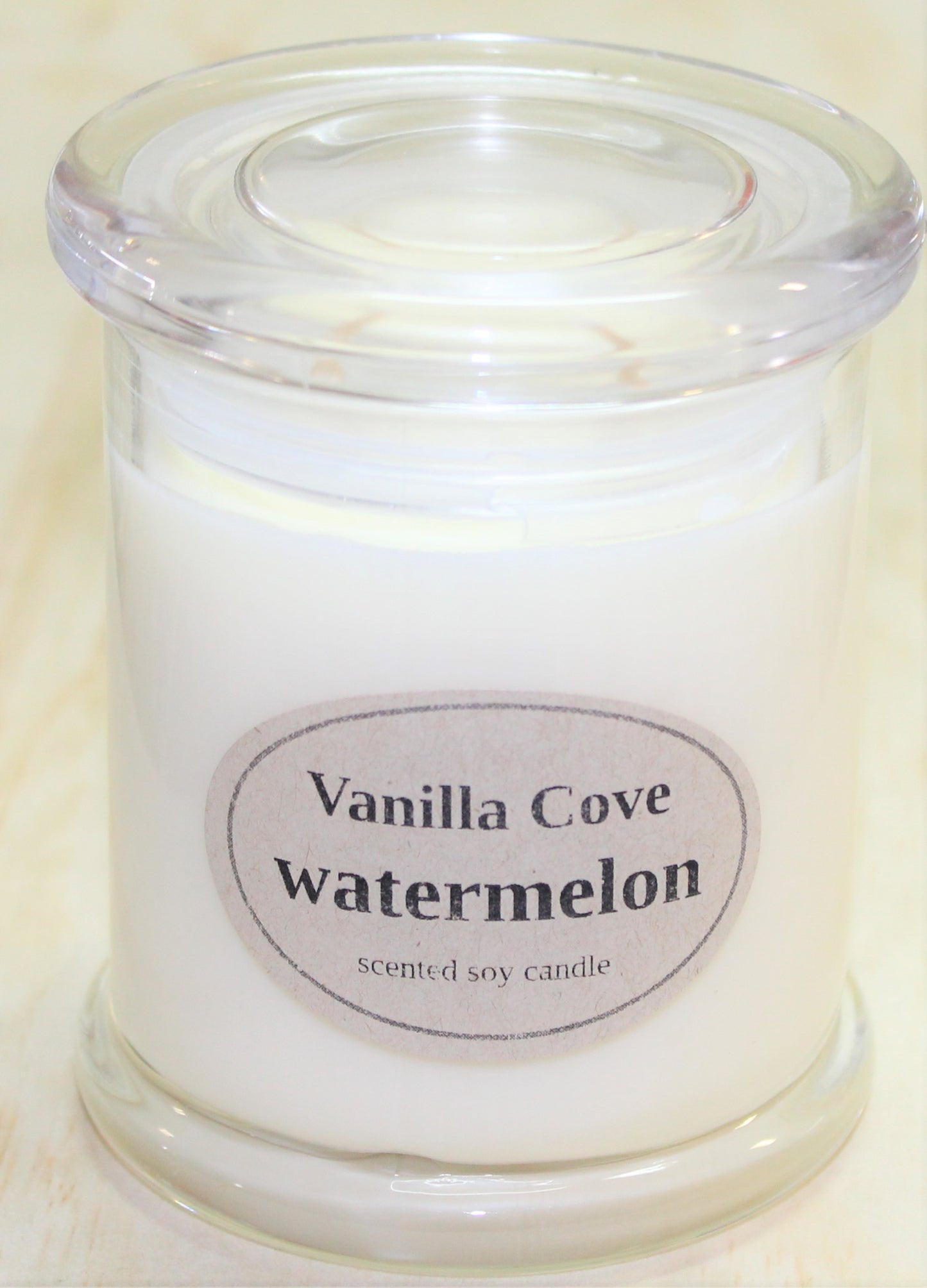 Vanilla Cove Soy Candle 50 hour Watermelon Fragrance in clear glass jar and glass lid